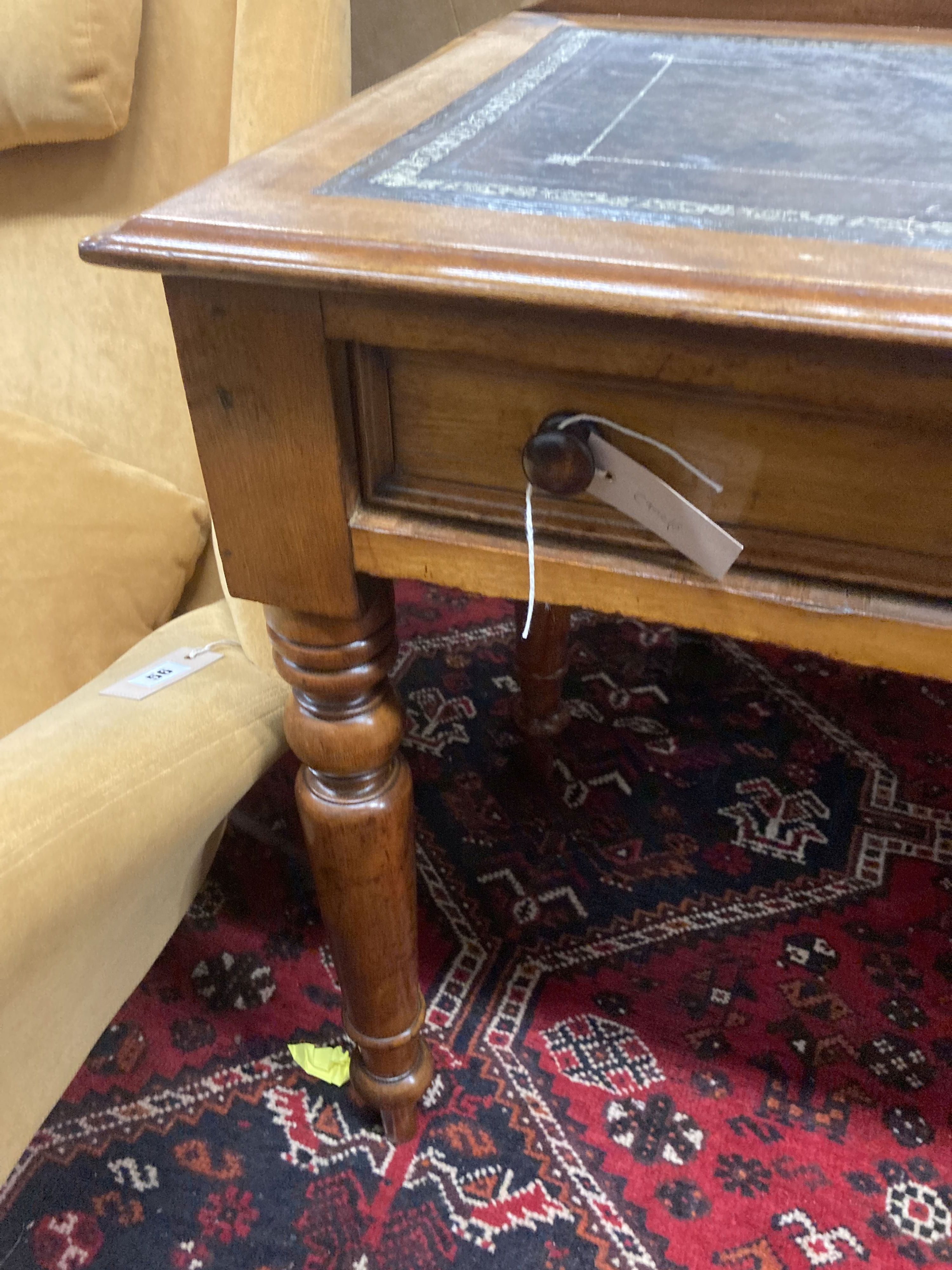 A Victorian mahogany two drawer writing table, with a leather inset top, width 114cm, depth 52cm, height 80cm